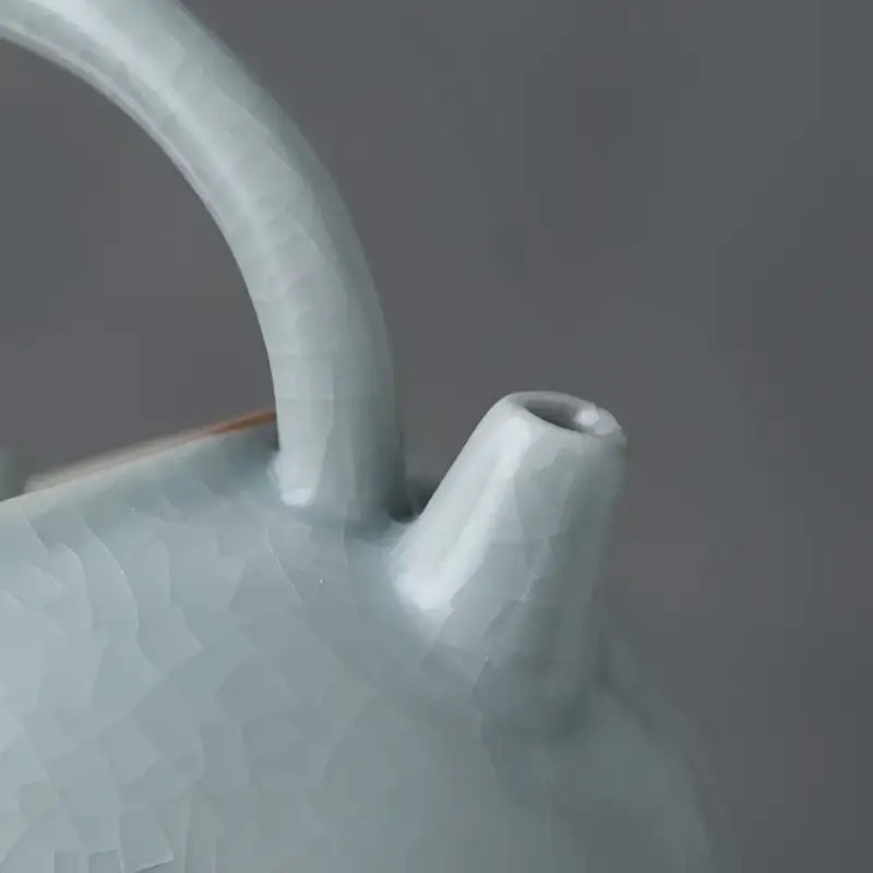 Pale blue Celadon Ru Kiln crackle glaze teapot showcasing tianqing glaze craftsmanship