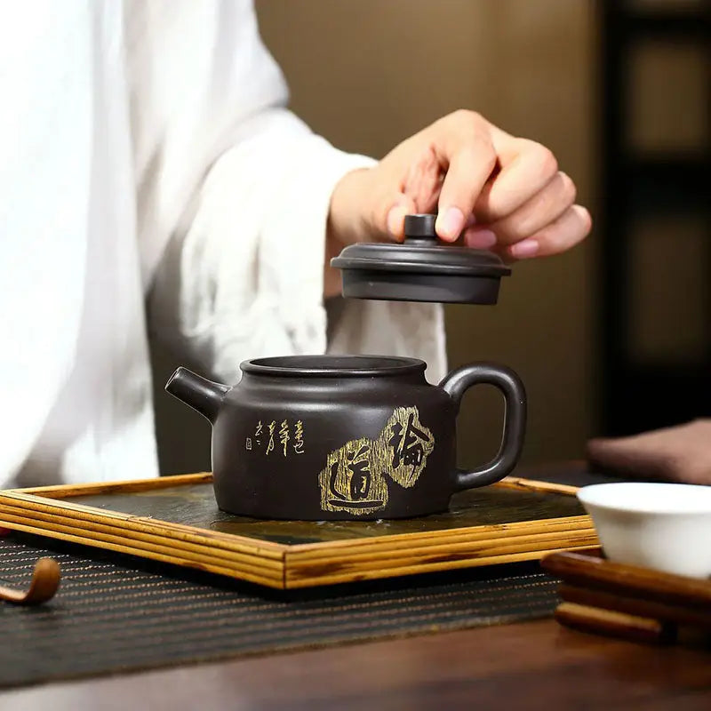 Dark brown Celestial Script Yixing Zisha Teapot with lid crafted from Zisha clay