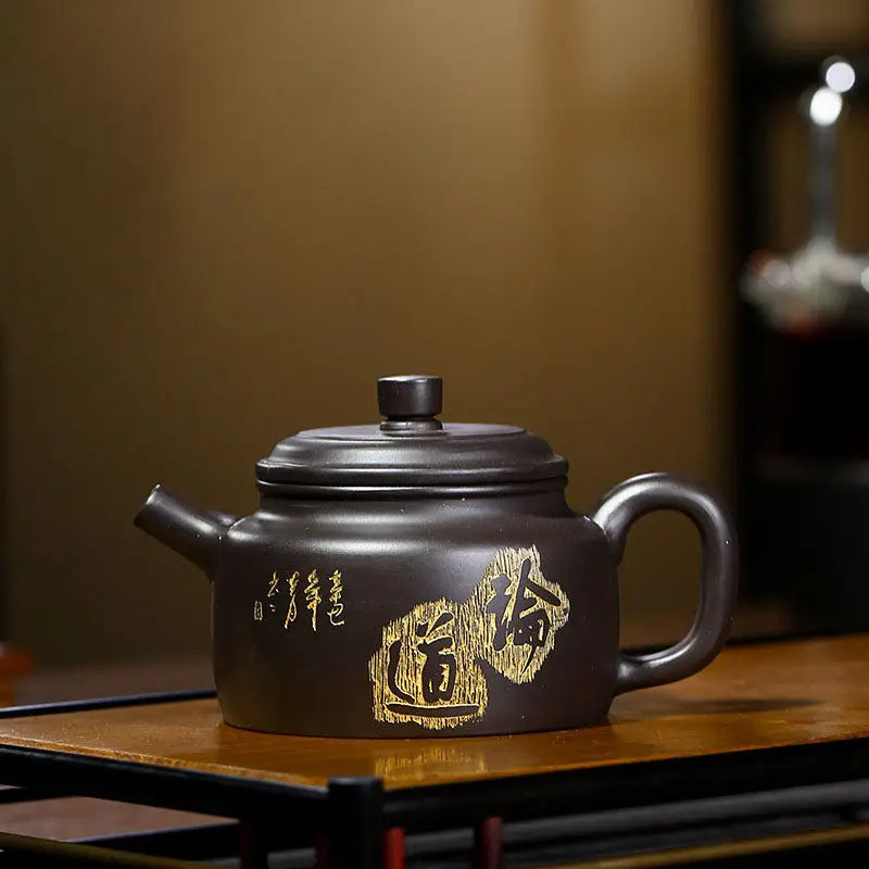 Dark brown Yixing Zisha Teapot with gold lettering from Celestial Script Yixing collection