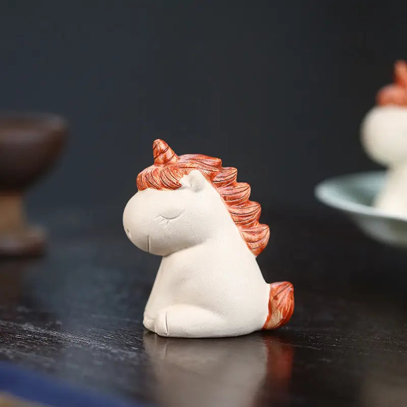 Ceramic Celestial Unicorn figurine with closed eyes, perfect tea pets guide for feng shui energy