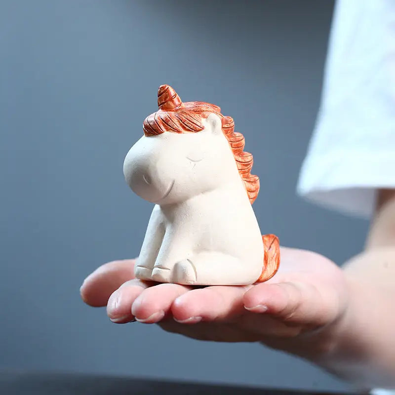 Cute ceramic celestial unicorn figurine from Celestial Unicorn tea pets guide for feng shui energy