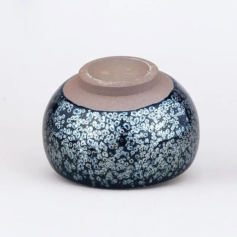 Round dark blue ceramic bowl from Cells with speckled pattern, ideal for Jian Zhan tea cups and gongfu tea brewing