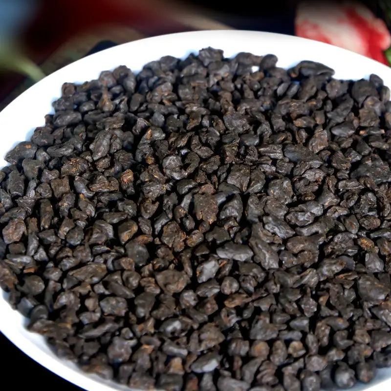 Dark irregular Cha Hua Shi Pu’er tea leaves suitable for teapots and tea sets