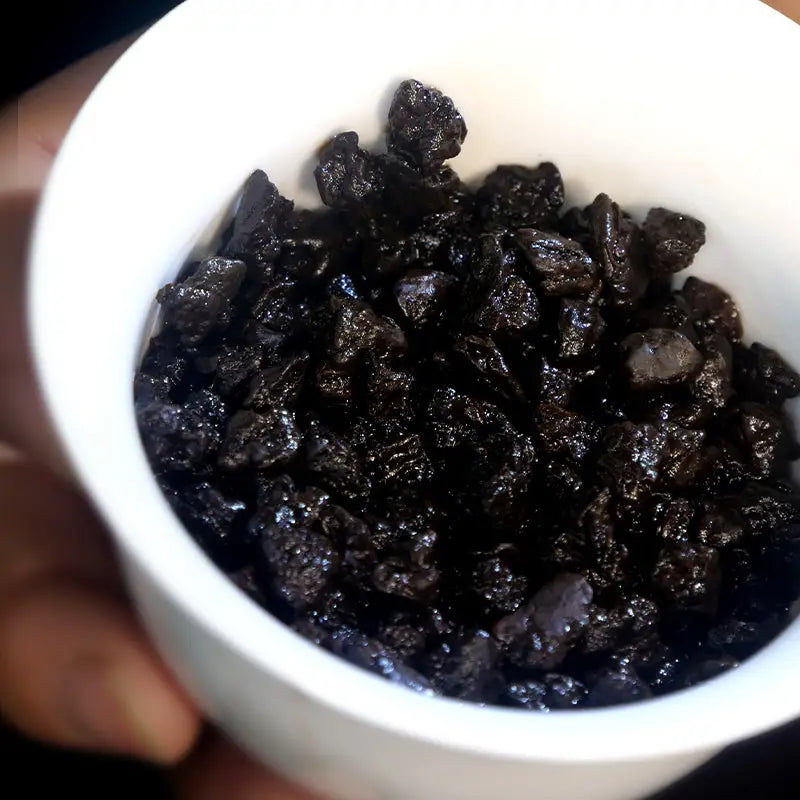 Bowl of dark dried fruit for Cha Hua Shi Pu’er Tea Leaves, ideal for teapots and tea sets