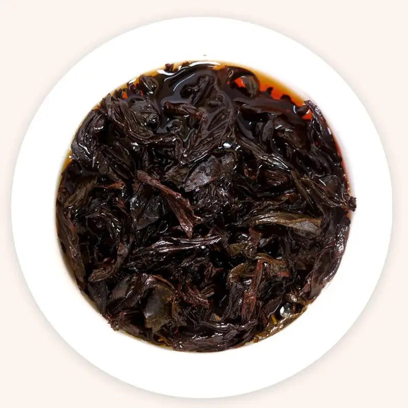 Dark steeped tea leaves for Cinna Mon Rock Tea Leave, perfect for teapots and mugs