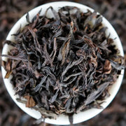 Loose dark dried tea leaves for Cinna Mon Rock Tea, perfect for teapots and tea sets