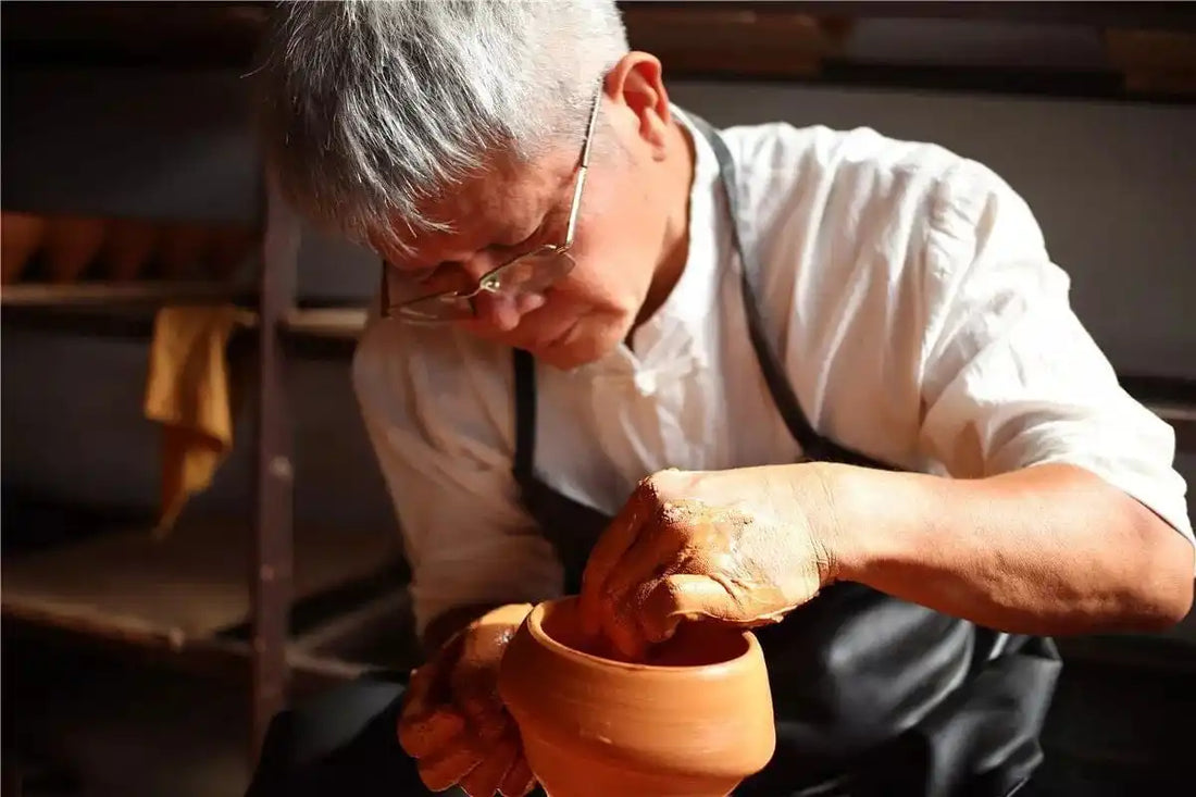 Clay pot being molded.