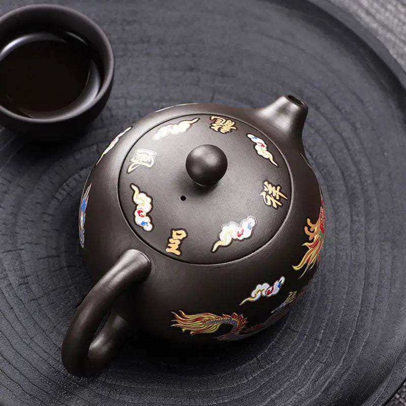 Ornate brown Zisha teapot with color-changing dragon and Phoenix Yixing design