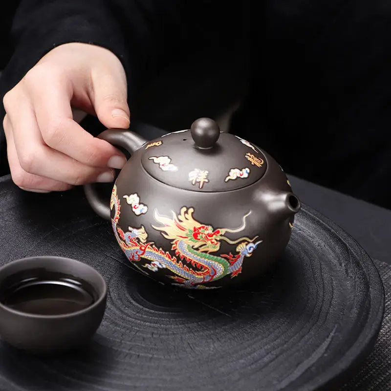 Color-changing dragon and phoenix Zisha Teapot with a brown dragon design