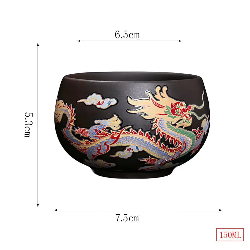 Black ceramic yixing zisha tea cup with color-changing dragon design for tea ritual drinking