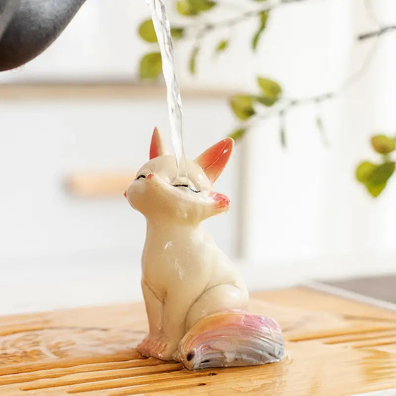 Ceramic Fox Tea Pet with closed eyes, perfect for feng shui and decorating your fox tea collection