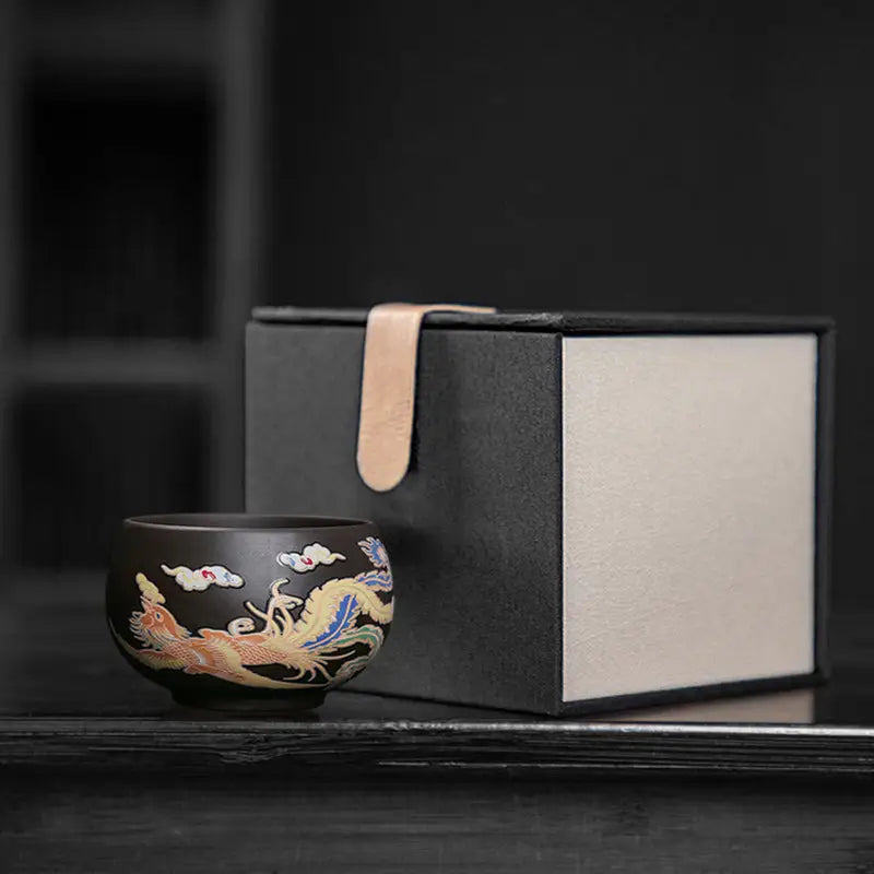 Decorated black Yixing Zisha teacup with gift box featuring hand-painted phoenix and color-changing phoenix design