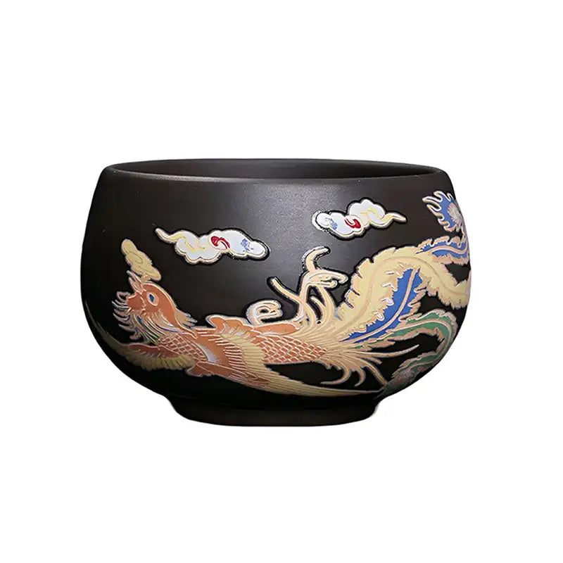 Dark ceramic Yixing Zisha cup featuring a hand-painted color-changing phoenix with clouds