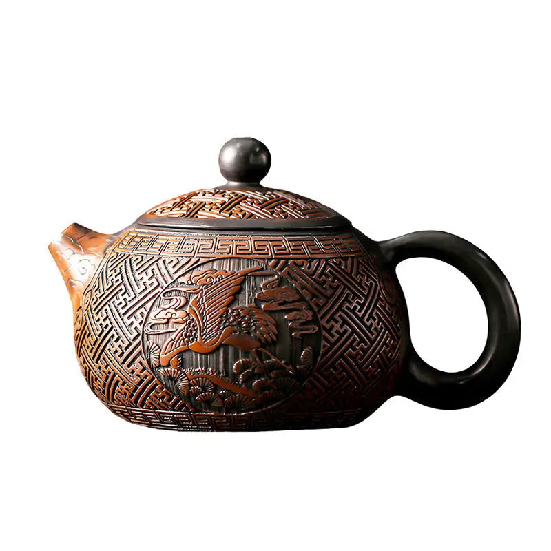 Ornate brown Jianshui Zitao teapot with bird design from Crane & Deer tea sets