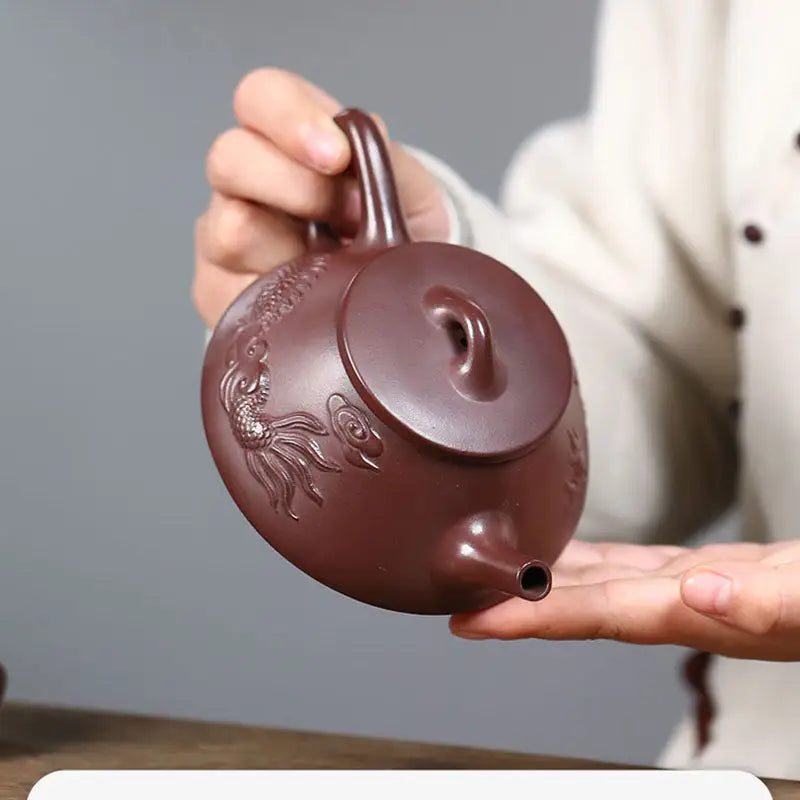Brown ceramic Creative Dragon Yixing Zisha teapot with intricate dragon design