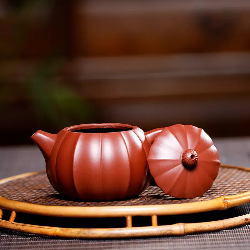Reddish-brown pumpkin-shaped Zisha teapot from Crimson Harvest displayed with lid