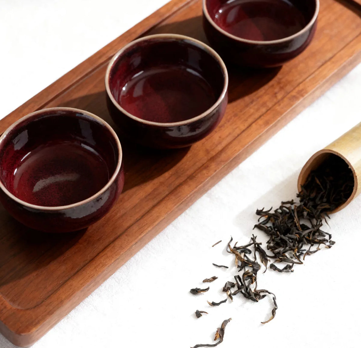 Crimson Jun Glaze Tea Cups — profile view