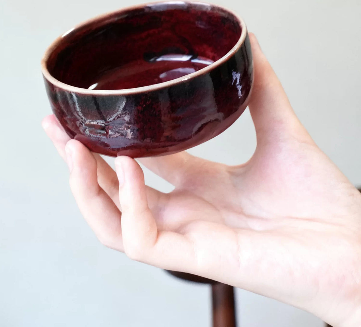 Crimson Jun Glaze Tea Cups — styled in context