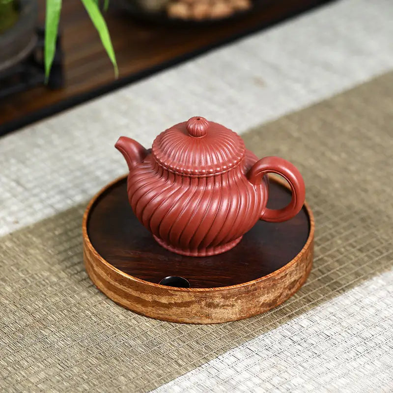 Red-brown ridged Yixing Zisha teapot named Crimson Spiral for handmade harmony