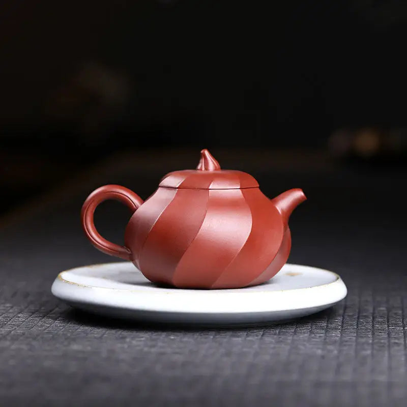 Red-brown ridged Yixing Zisha teapot Crimson Spiral for authentic Gongfu brewing