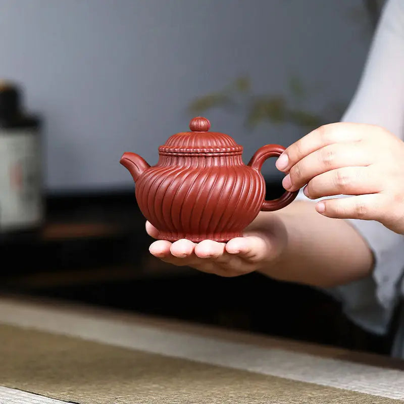 Reddish-brown ridged handmade Yixing Zisha teapot from Crimson Spiral Harmony collection