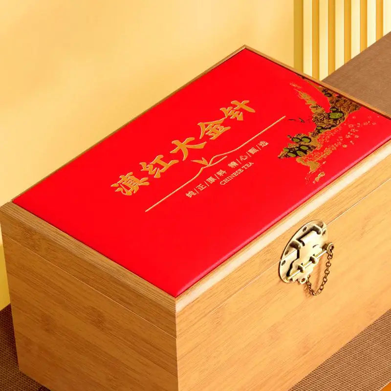 Red-topped wooden box with gold clasp for Da Jin Zhong Black Tea Leaves used in teapots and tea sets