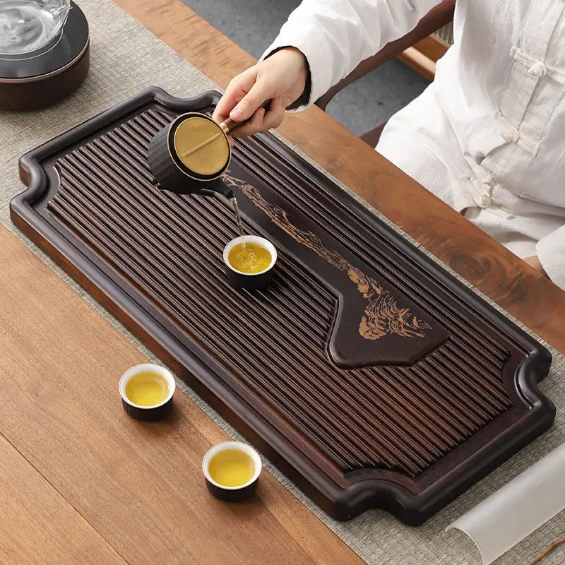 Dark wooden tea tray with cups from Distant Mountains Bamboo Tea Tray for gongfu tea