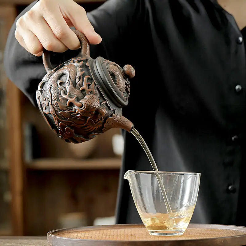Dragon King II Jianshui Zitao pottery teapot with dragon adornments pouring tea