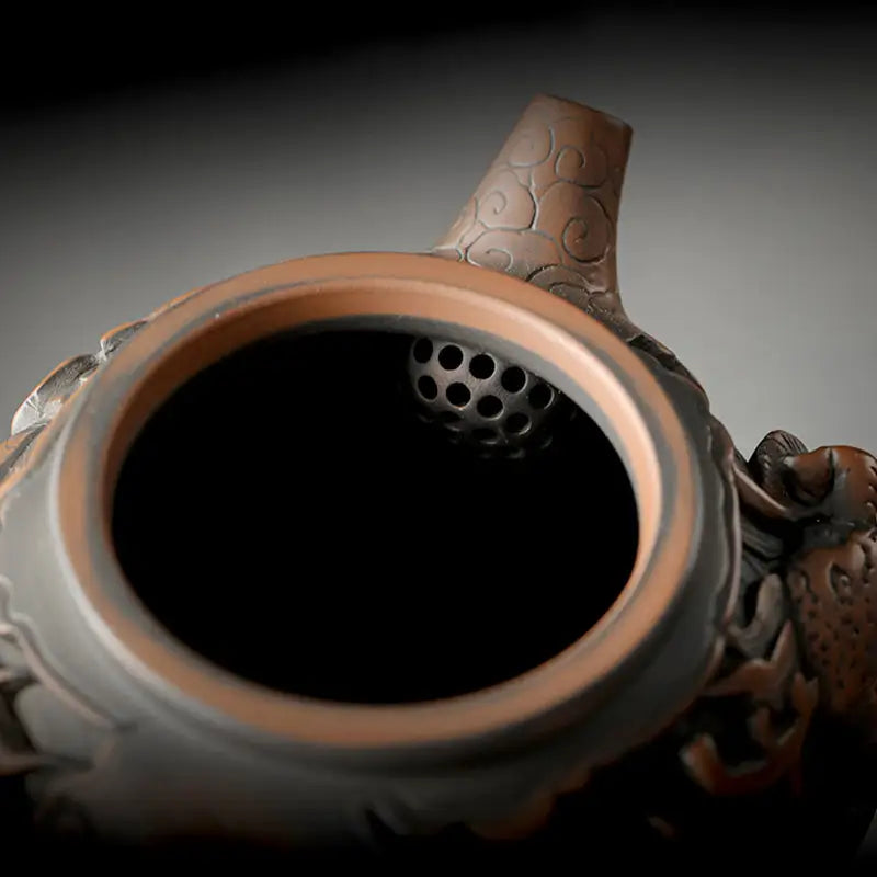 Ornate brown teapot interior from Dragon King II made with Jianshui Zitao Jianshui pottery