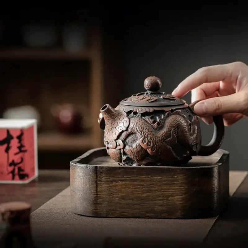 Ornate dragon-themed teapot made from hand-carved Jianshui Zitao clay showcasing dragon symbolism
