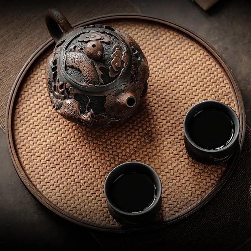 Ornate brown jianshui zitao clay teapot and teacups with dragon symbolism for Dragon King