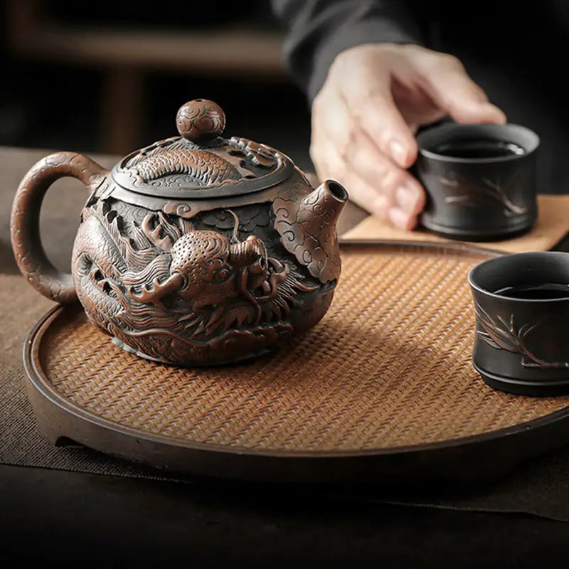 Ornate dragon-themed teapot made of hand-carved Jianshui Zitao clay featuring dragon symbolism