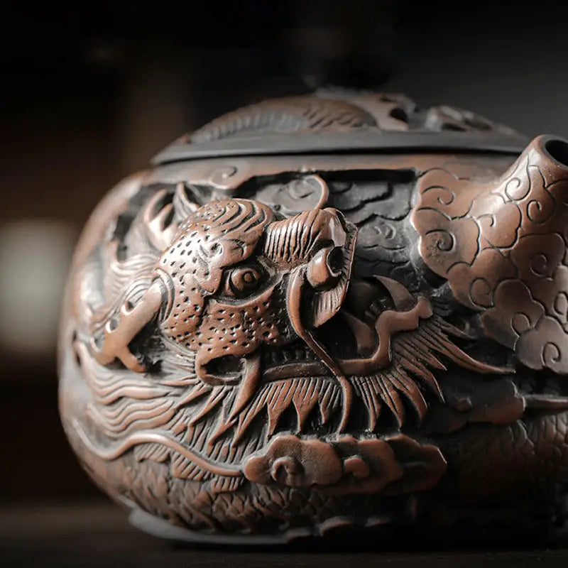 Ornate bronze Dragon King teapot featuring hand-carved Jianshui Zitao clay and dragon symbolism