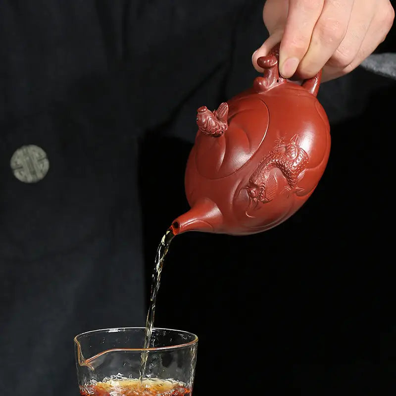 Red clay Yixing Zisha teapot with dragon design symbolizing carp ascending in traditional craftsmanship