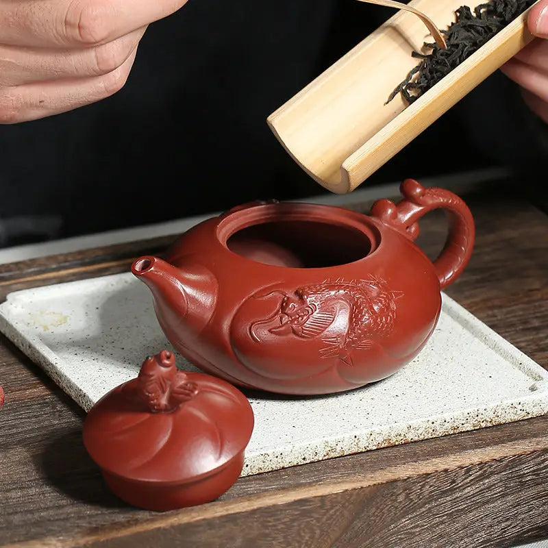 Red clay Yixing teapot with dragon and carp ascending design in Yixing Zisha clay