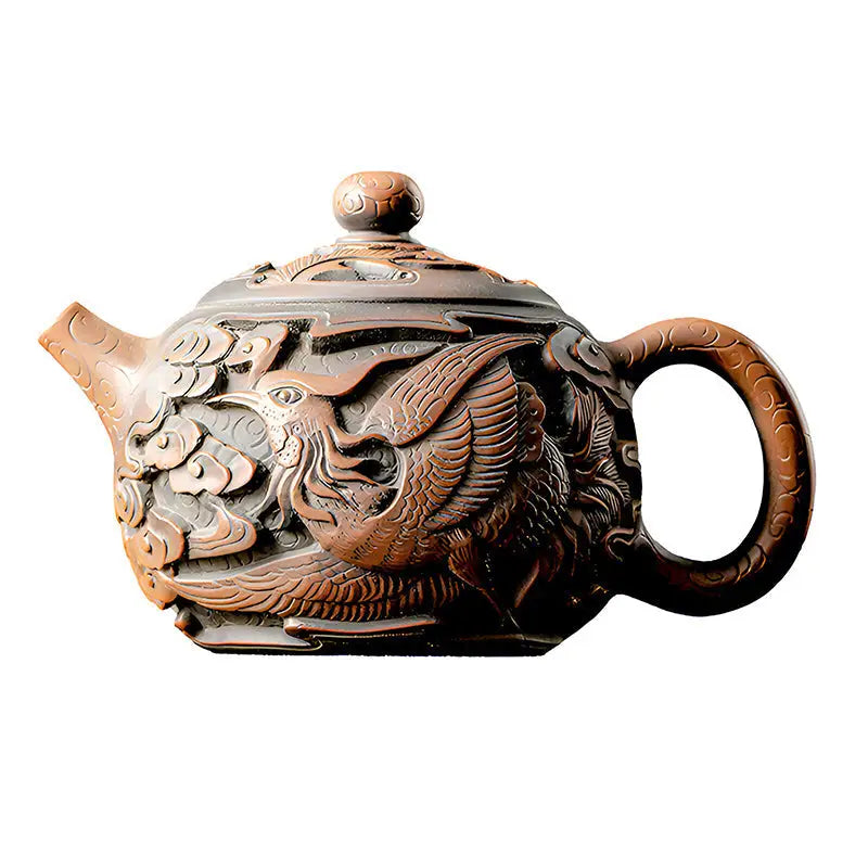 Ornate brown Jianshui Zitao teapot with hand-carved phoenix design in purple clay