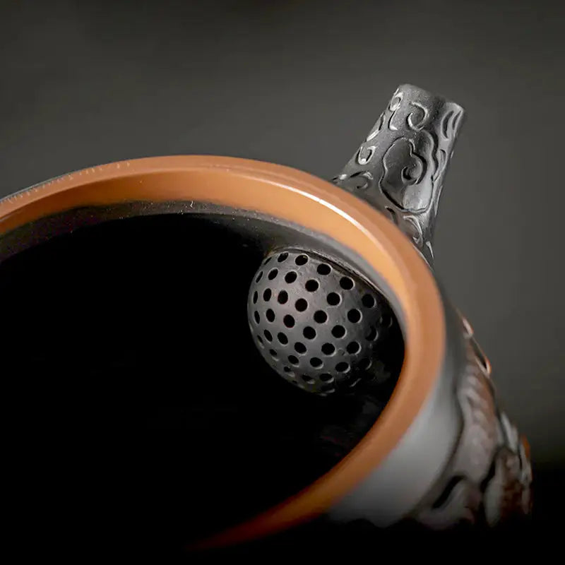 Ornate dark interior of Dragon & Phoenix Zitao Tea Pot made from Jianshui Zitao Teapot purple clay gongfu tea
