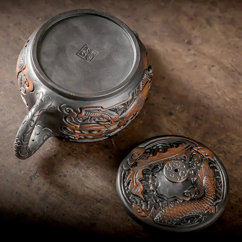 Ornate dark metal dragon motif teapot from Dragon & Phoenix, ideal jianshui zitao teapot for purple clay gongfu tea