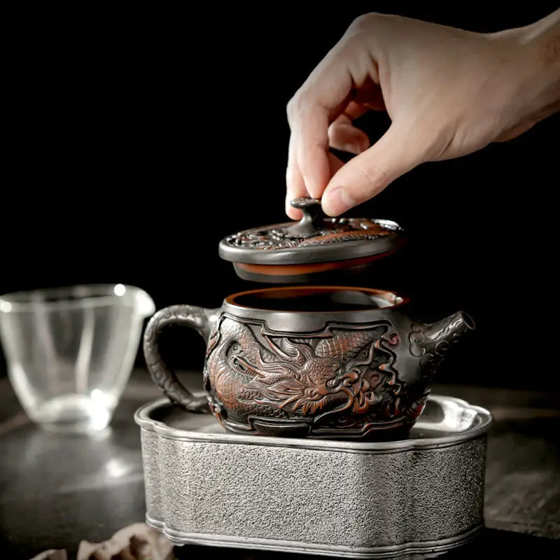 Ornate dragon-themed Jianshui Zitao teapot for purple clay gongfu tea brewing