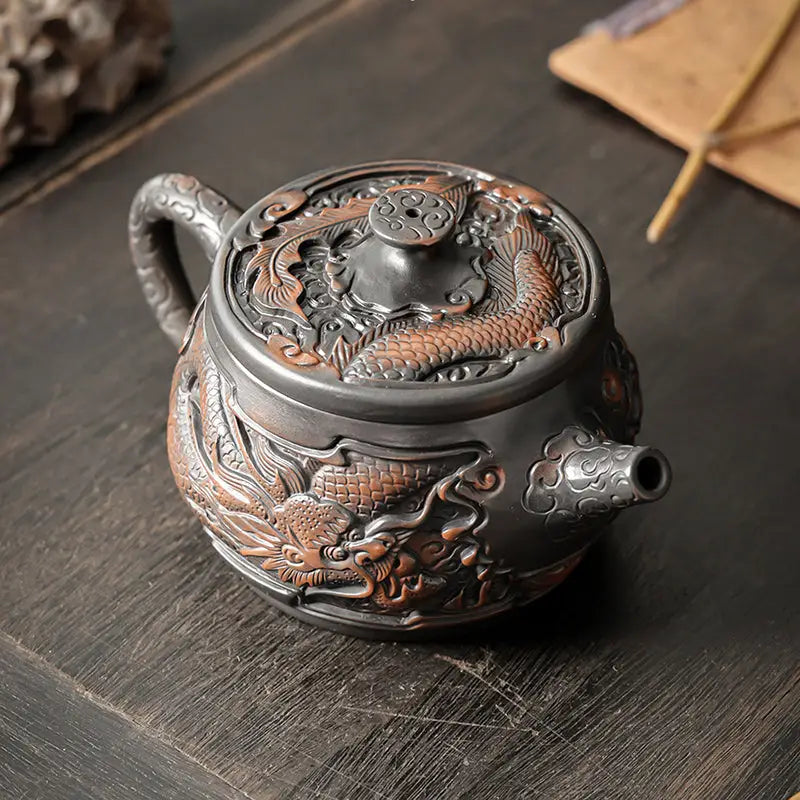 Ornate dark metal Dragon & Phoenix jianshui zitao teapot with dragon and fish designs