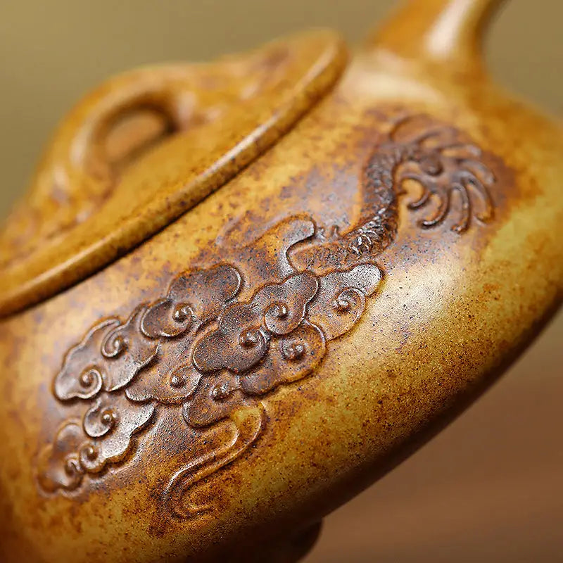 Ornate brown Yixing Teapot with Dragon Carvings made of Duanni Clay for Tea Enthusiasts