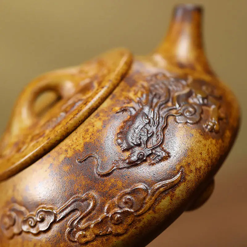 Ornate brown Dragon Root container with dragon carvings in duanni clay, perfect for yixing teapots