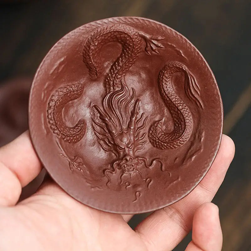 Brown ceramic Dragon Spirit teacup with intricate dragon relief design