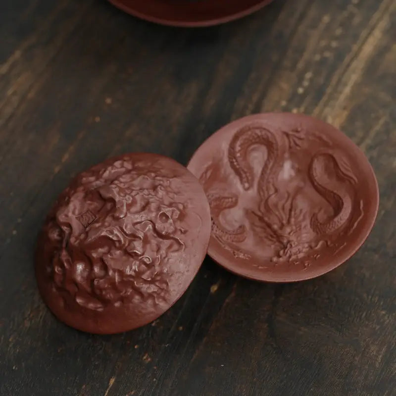 Brown chocolate medallions from Dragon Spirit in a spirit teacup display