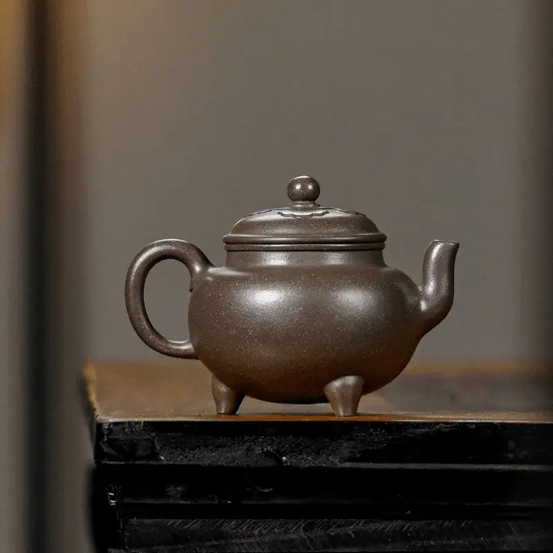 Brown ceramic Dragon Tripod Yixing Zisha teapot with lid perfect for traditional brewing