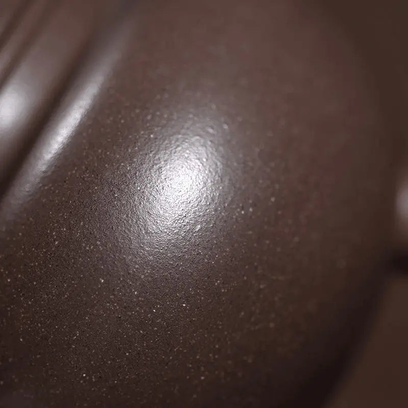 Smooth dark brown surface of Dragon Tripod showcasing Yixing Zisha craftsmanship for Yixing teapots