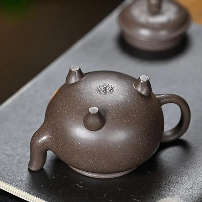Brown ceramic Dragon Tripod Yixing Zisha teapot with tripod feet for tea brewing