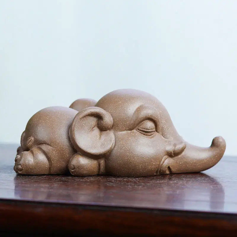 Sleeping clay elephant from Dreaming Elephant tea pet collection for feng shui tea pets
