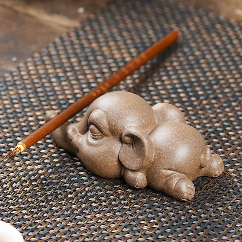 Brown ceramic Elephant Brush Rest from Dreaming Elephant Tea, ideal Feng Shui tea pet