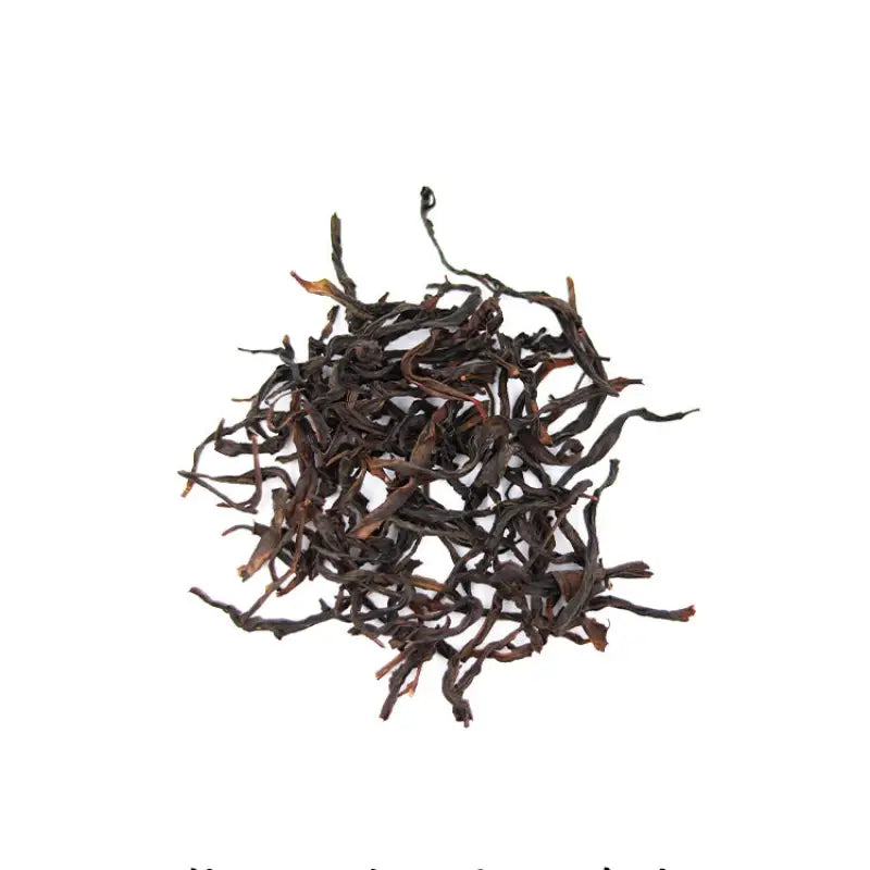 Pile of dried black tea leaves for Duck Shit Aroma Dancong Oolong Tea, Phoenix Dancong style